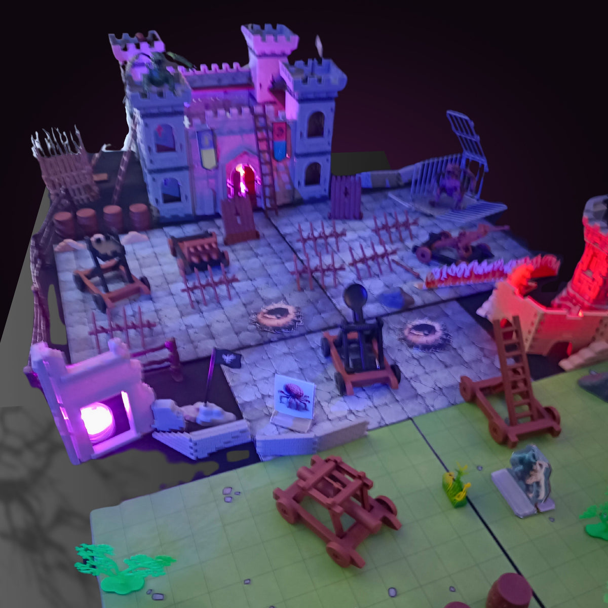 FOXBITE Kingdom Siege D&D castle set assembled with catapults and terrain pieces on battle map