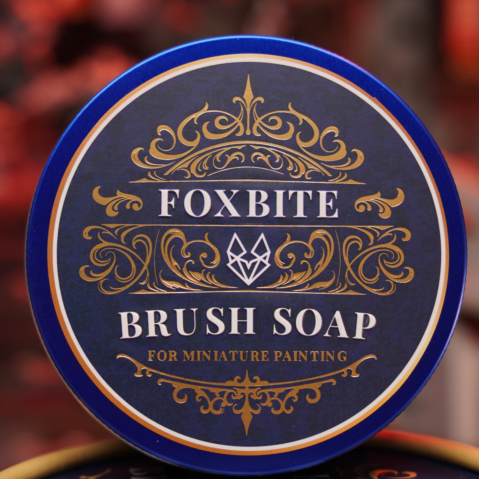 Cleaning a fine detail miniature painting brush with FOXBITE Brush Soap