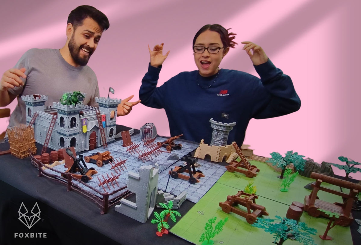 FOXBITE Kingdom Siege D&D terrain set unboxed and fully set up – lifestyle photo with players